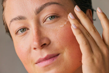 woman applying retinol