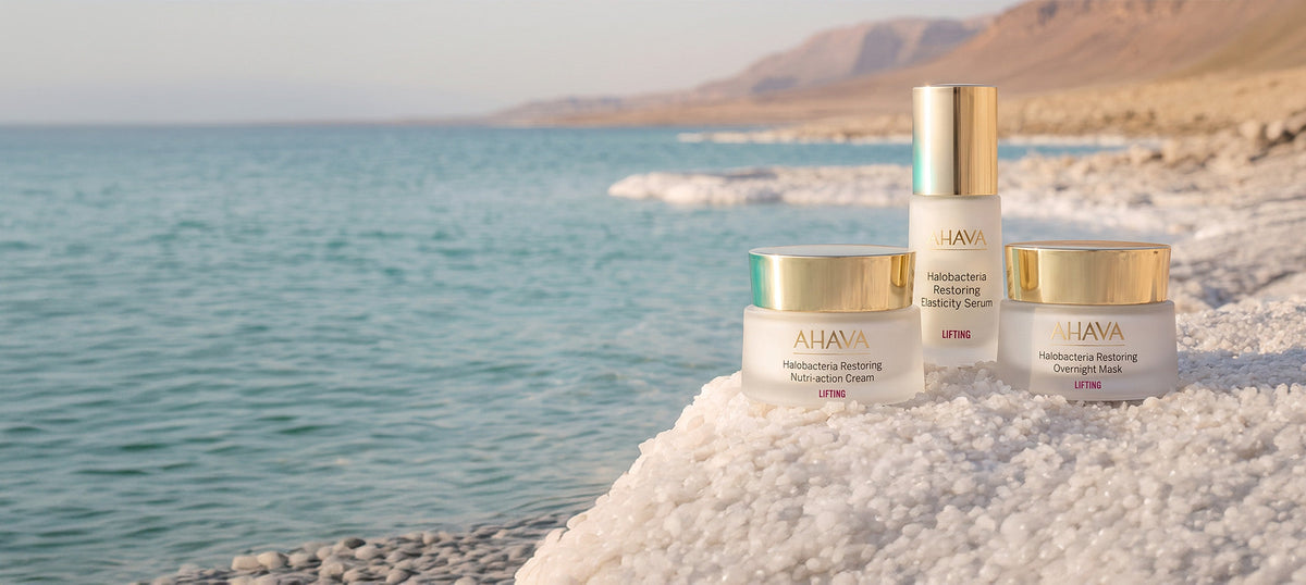 Elegant mature model using AHAVA Halobacteria restorative skincare for advanced skin rejuvenation